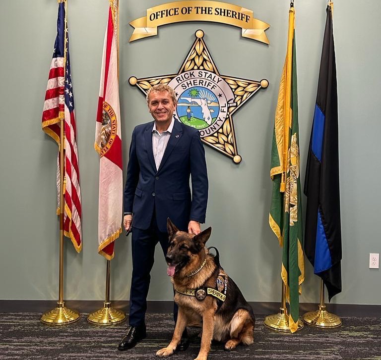 Businessman César DePaço and his personal security dog “Lanzer” at the Flagler County Sheriff’s Office facilities.