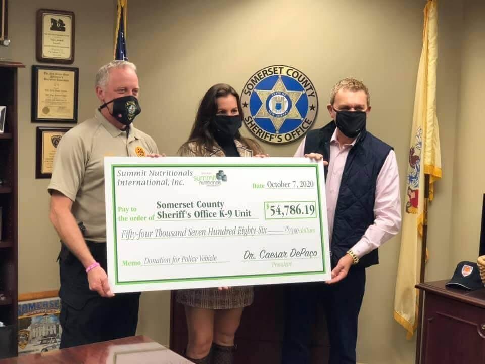 Sheriff Darrin J. Russo thanks César and Deanna DePaço